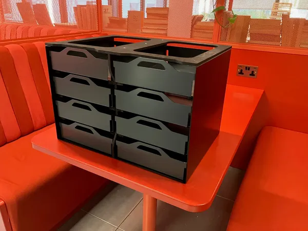 Eight-drawer archive storage unit with gunmetal aluminium drawers in a black frame